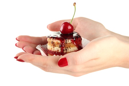 Woman hands holding tasty biscuit cake with jam and berry, isolated on whiteの写真素材