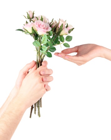 Man's hand giving a roses isolated on whiteの写真素材