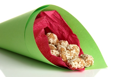 Tasty peanuts with sesame and caramel, isolated on whiteの写真素材