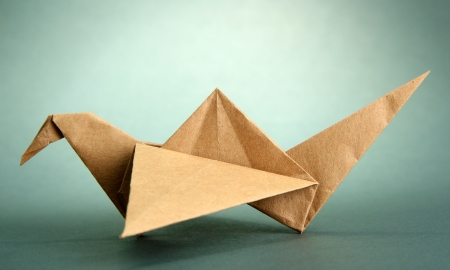 Origami crane on grey backgroundの写真素材