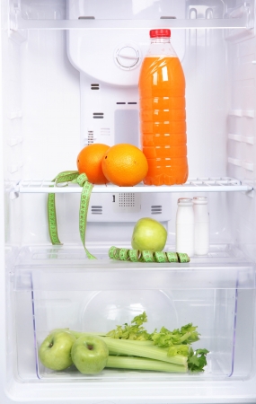 Open refrigerator with diet foodの写真素材