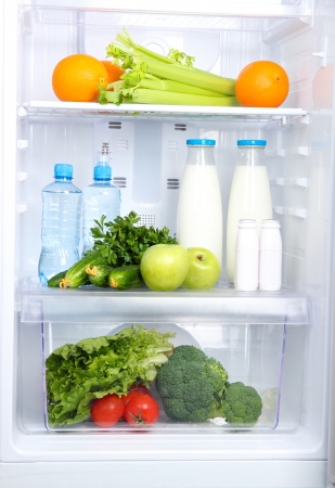 Open refrigerator with vegetarian foodの写真素材