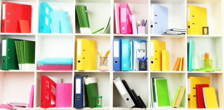 White office shelves with different stationery, close upの写真素材