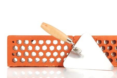 Metal tool for building and bricks isolated on whiteの写真素材