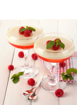 fruit jelly with berries in glasses on wooden tableの写真素材