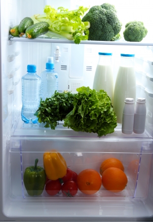Open refrigerator with vegetarian foodの写真素材