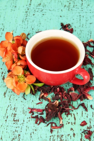 Herbal tea in cup, on color wooden backgroundの写真素材