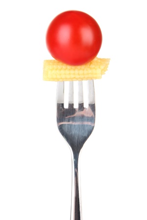 Baby corn and cherry tomato sticking on fork, isolated on whiteの写真素材