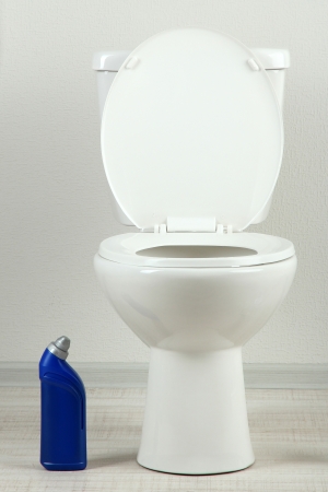 White toilet bowl and  cleaner bottle in a bathroomの写真素材