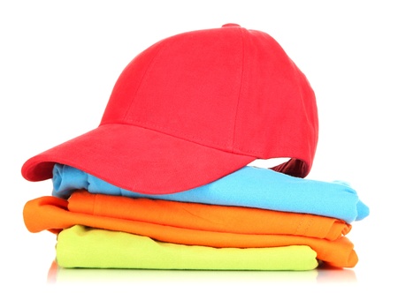 Red peaked cap with T-shirts isolated on whiteの写真素材