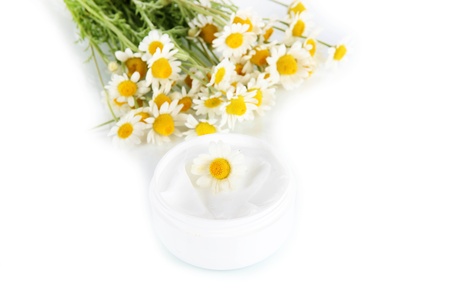 Cream with chamomile isolated on whiteの写真素材