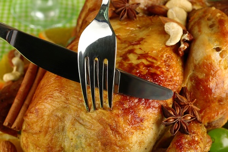 Cutting baked chicken close-up. Thanksgiving Dayの写真素材