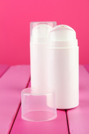 Bottle with cream, on color backgroundの写真素材