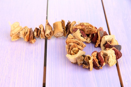 Dried mushrooms on wooden backgroundの写真素材