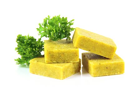 Bouillon cubes with parsley, isolated on whiteの写真素材