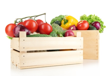 Fresh vegetables in wooden boxes on white backgroundの写真素材
