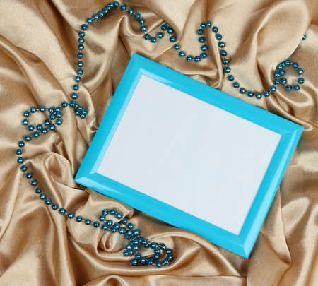 Empty frame on beautiful silk backgroundの写真素材