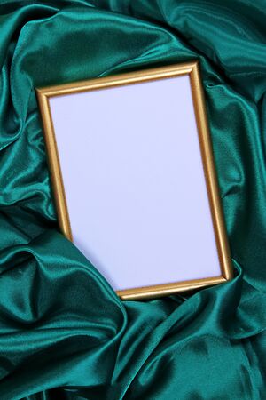 Empty frame on beautiful silk backgroundの写真素材