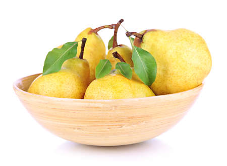 Juicy pears in wooden bowl isolated on whiteの写真素材