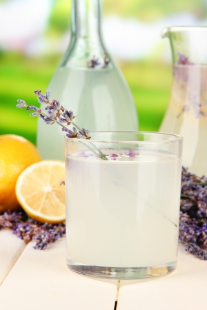 Lavender lemonade in bottle and jug, on bright backgroundの写真素材