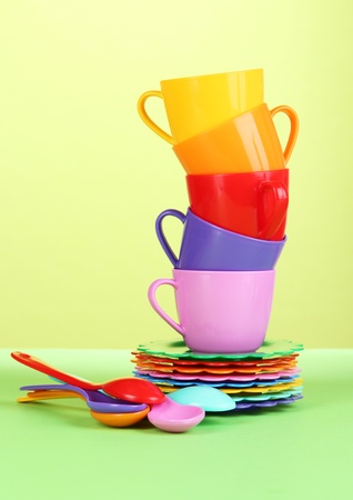 Set of children's dishes on light green backgroundの写真素材