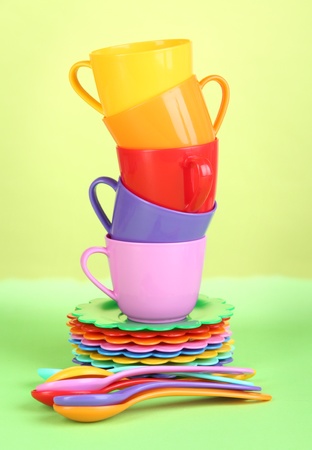 Set of children's dishes on light green backgroundの写真素材