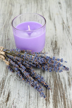 Lavender candle with fresh lavender, on wooden backgroundの写真素材