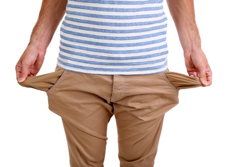 Man showing his empty pockets, isolated on whiteの写真素材