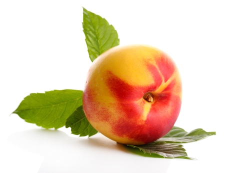 ripe nectarine, isolated on whiteの写真素材