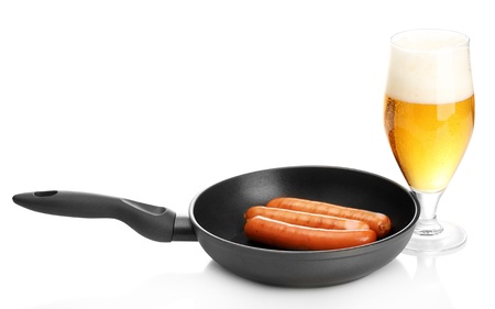 Beer and grilled sausages isolated on whiteの写真素材