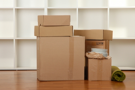 Moving boxes in empty roomの写真素材