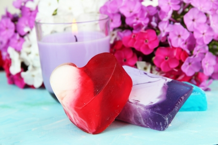 Pieces of handmade soap with herbs, on bright backgroundの写真素材