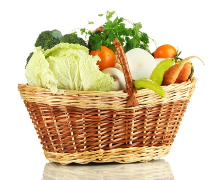 Fresh vegetables in basket isolated on whiteの写真素材
