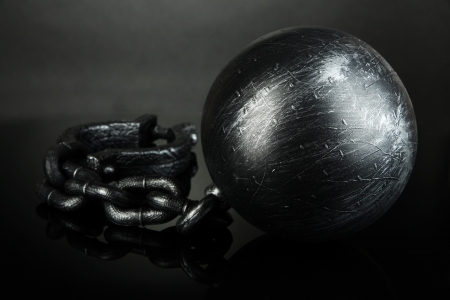 Ball and chain on grey backgroundの写真素材