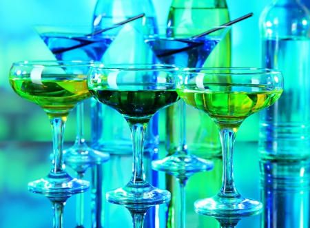 Glasses of cocktails on bright backgroundの写真素材