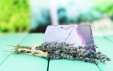 Piece of handmade soap with lavender oil, on bright backgroundの写真素材