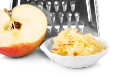 Metal grater and apple, isolated on whiteの写真素材