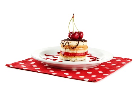 Tasty biscuit cake on plate isolated on whiteの写真素材
