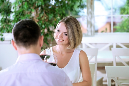 Beautiful couple having  romantic dinner at restaurantの写真素材