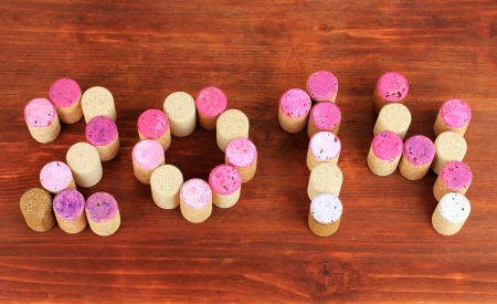 2014 laid out for wine corks on wooden table close-up