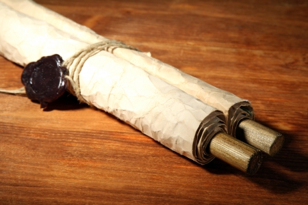 Old scroll, on wooden backgroundの写真素材