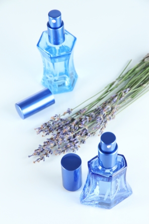 Perfume in bottles and lavender isolated on whiteの写真素材