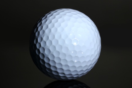 Golf ball on grey backgroundの写真素材