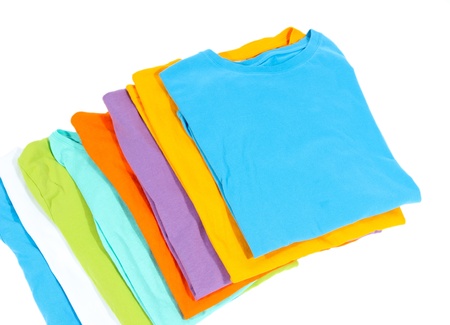 Neatly folded shirts isolated on whiteの写真素材