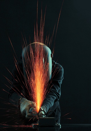 Portrait of workman in black mask, isolated on blackの写真素材