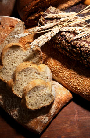 Much bread on wooden boardの写真素材