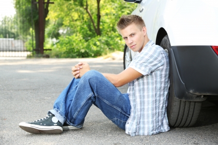 Man on the road with car breakdown waiting for rescueの写真素材