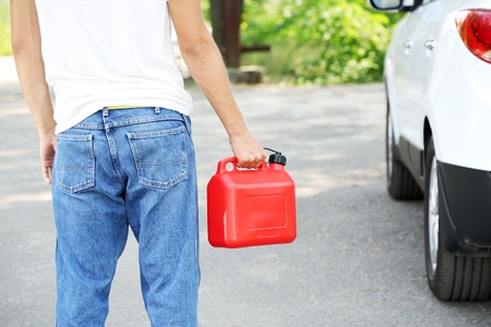 Man handling fuel tankの写真素材
