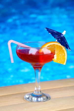 Tasty cocktail on swimming pool backgroundの写真素材