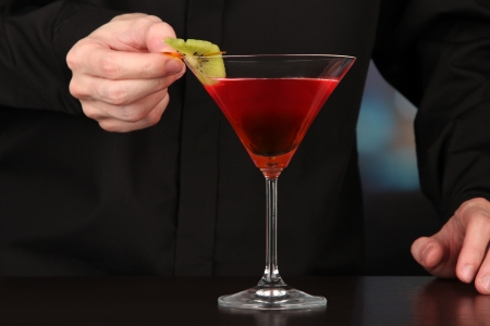 Bartender making and decorating cocktail on close-upの写真素材